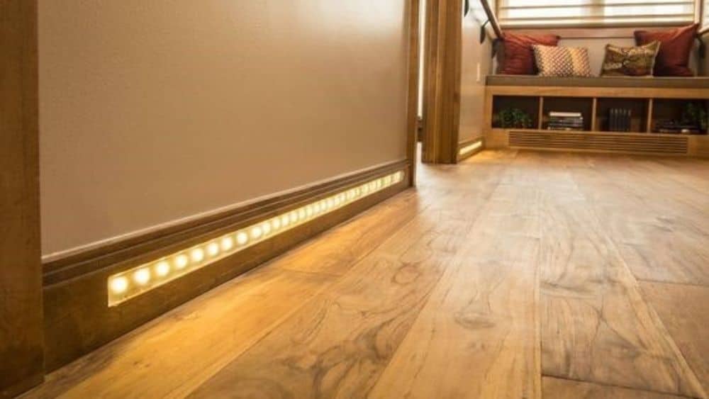 Baseboards with inset lighting.
