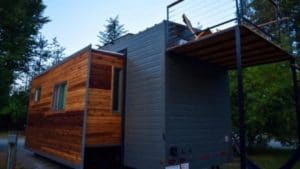Tiny home with a slide-out portion on the side.