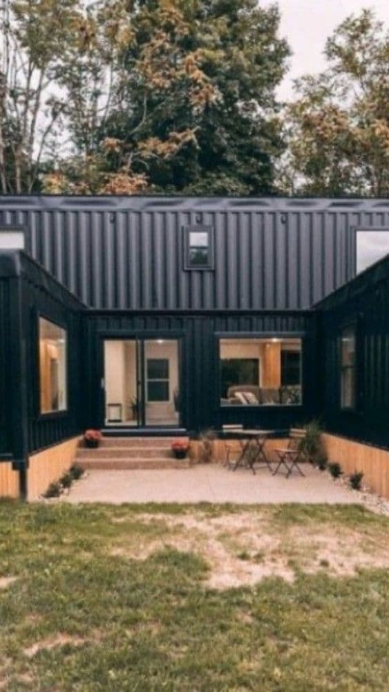 Tiny home divided into two sections by a living space.