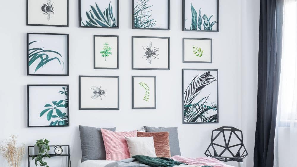 Minimalist gallery wall featuring nature artwork.